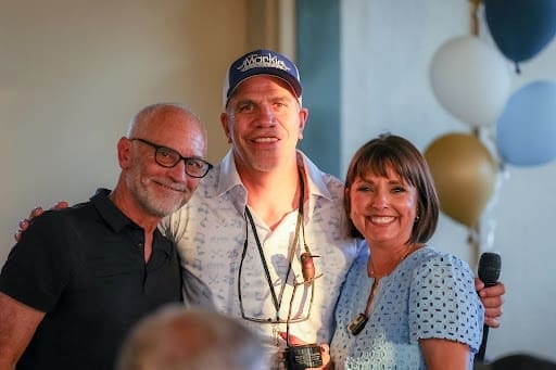 Ken Sommer (left) honors The Markie Foundation co-founders Joe and Janis Wuelfing with a George Mark Children’s House “Hummingbird Award.”
